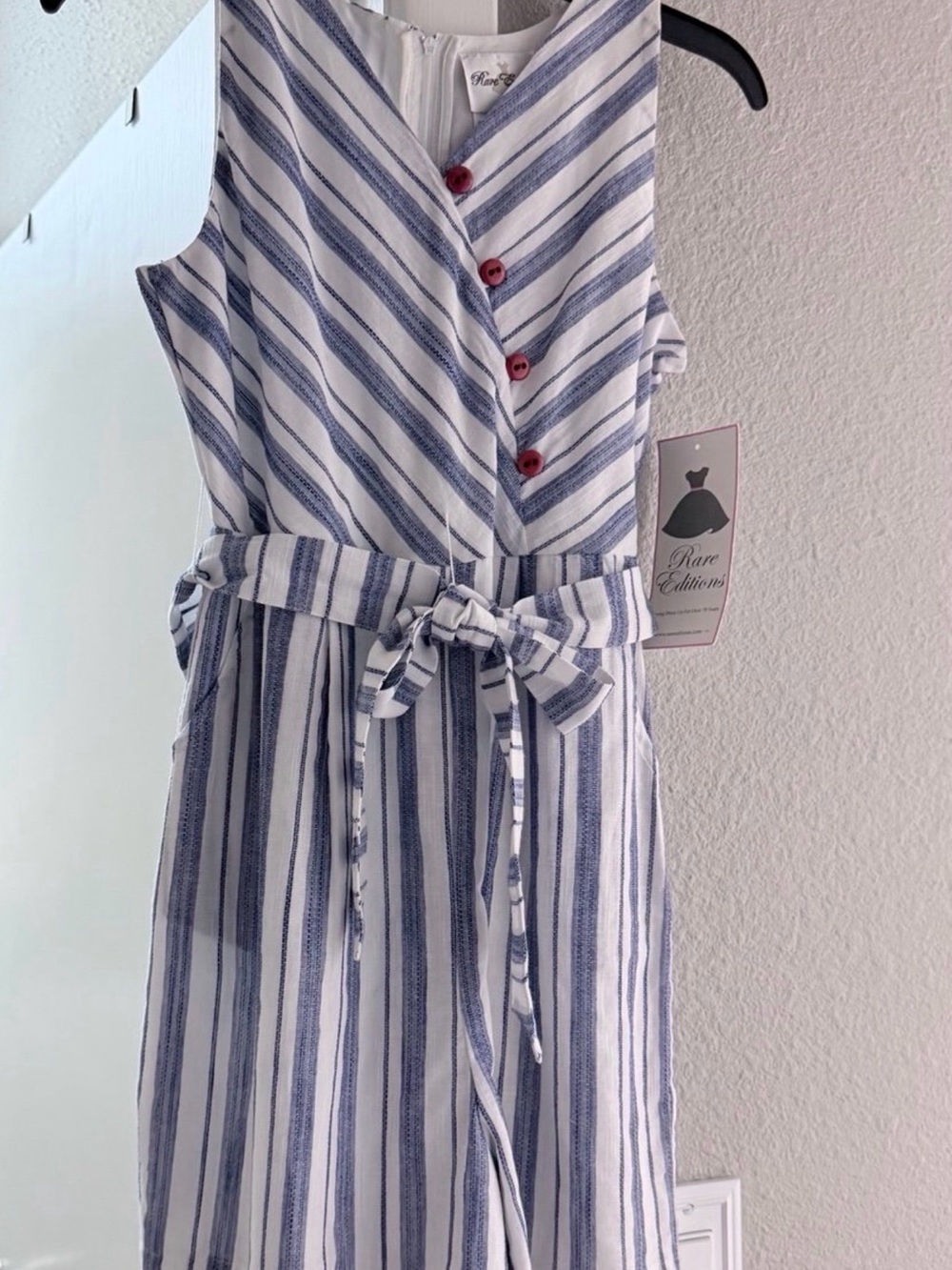 Sleeveless V-Neck Jumpsuit With Red Button Accents